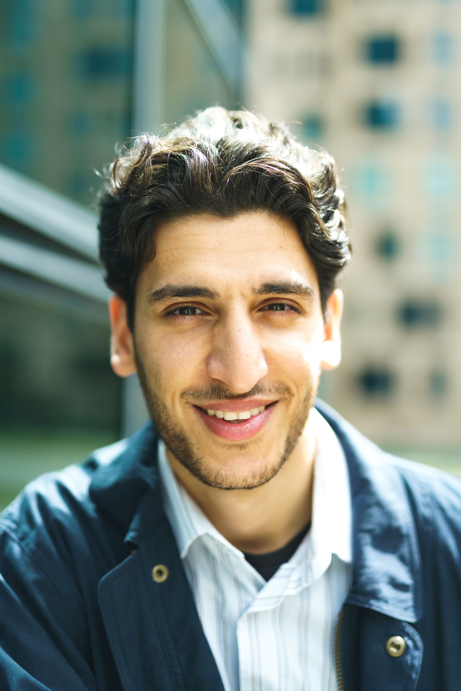 Illustrative portrait for the case: aligners first, then two veneers